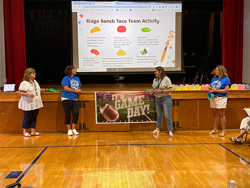 Four teachers giving a presentation