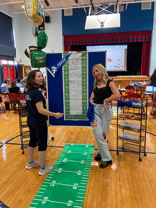 Two teachers giving a presentation