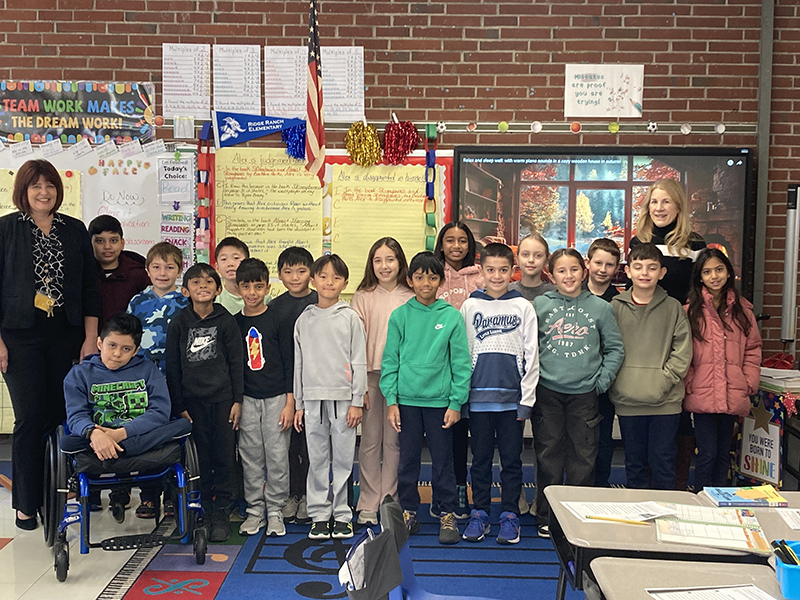 Mrs. D'Angelo's third grade class posing for a picture in the classroom after winning math marathon