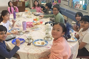 Students eating and drinking tea