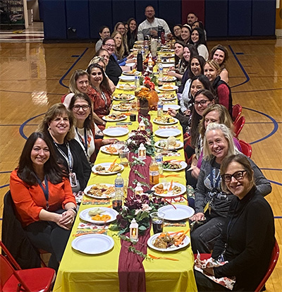 Group of staff at a table eating